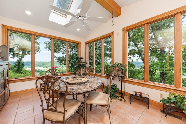 sunroom / solarium featuring plenty of natural light and vaulted ceiling with skylight