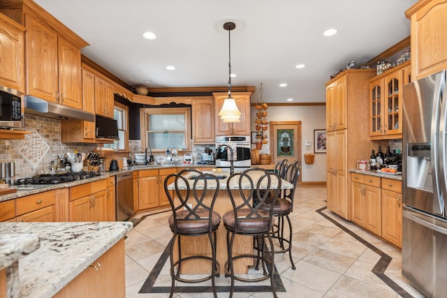 kitchen with decorative light fixtures, light tile patterned floors, light stone counters, and stainless steel appliances