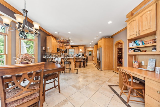 dining area featuring ornamental molding, a chandelier, and light tile patterned flooring