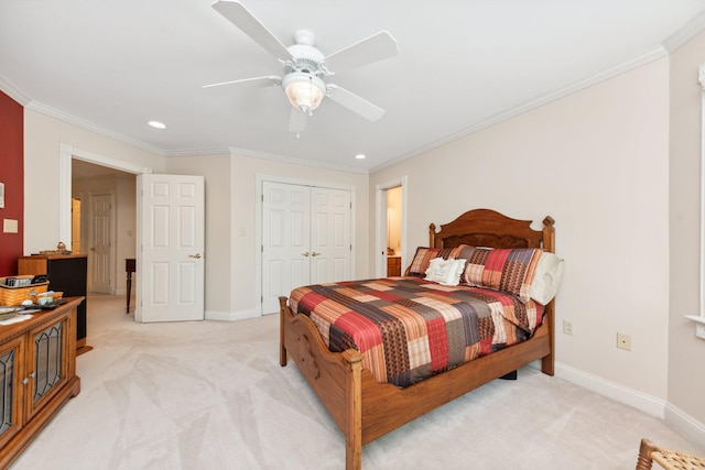 bedroom featuring light colored carpet, ceiling fan, ornamental molding, and a closet