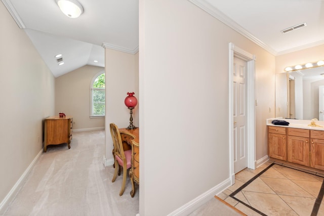 corridor with lofted ceiling, light carpet, crown molding, and sink