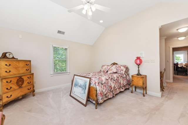 bedroom with lofted ceiling, ceiling fan, and light carpet