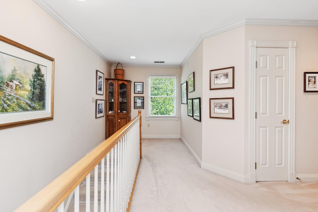 corridor with crown molding and light colored carpet