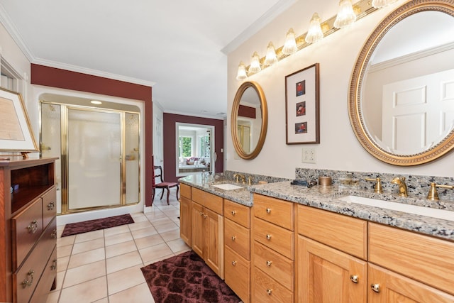 bathroom with ornamental molding, vanity, an enclosed shower, and tile patterned flooring