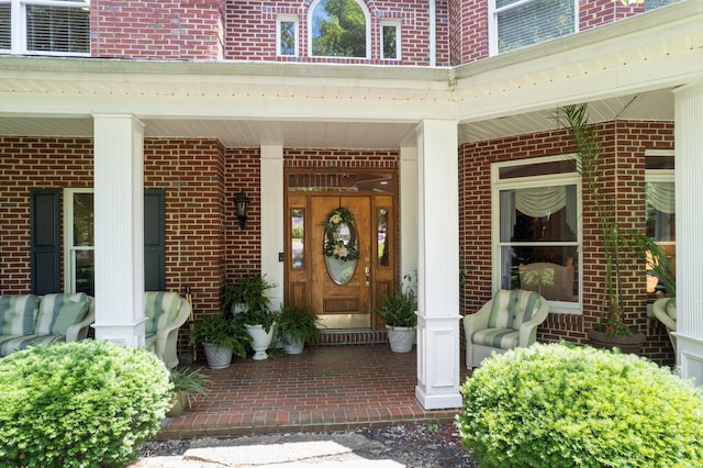 entrance to property featuring covered porch