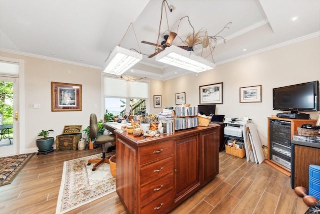 office area with a wealth of natural light, crown molding, a tray ceiling, and light hardwood / wood-style floors