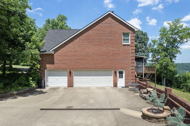 view of property exterior with a wooden deck