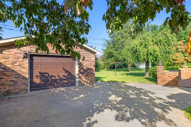 garage with a yard