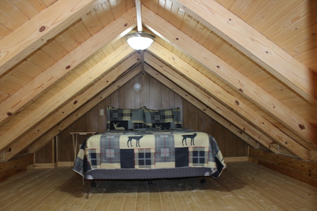 bedroom with wood ceiling, vaulted ceiling, and hardwood / wood-style flooring