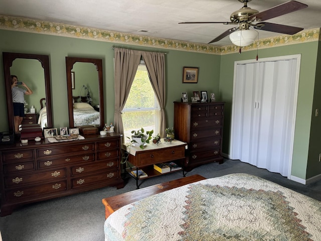 bedroom with a closet, baseboards, carpet floors, and ceiling fan