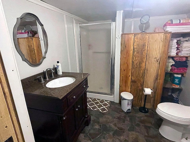 bathroom with tile patterned flooring, a shower with shower door, toilet, and vanity