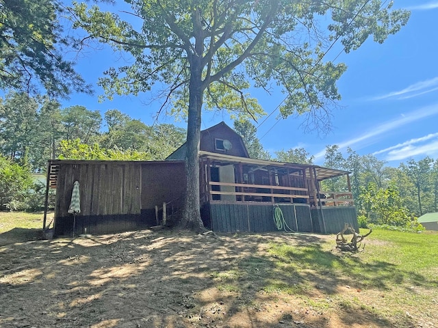 view of property exterior featuring a lawn