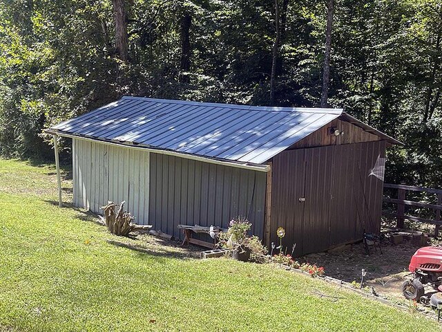 view of outbuilding with a yard