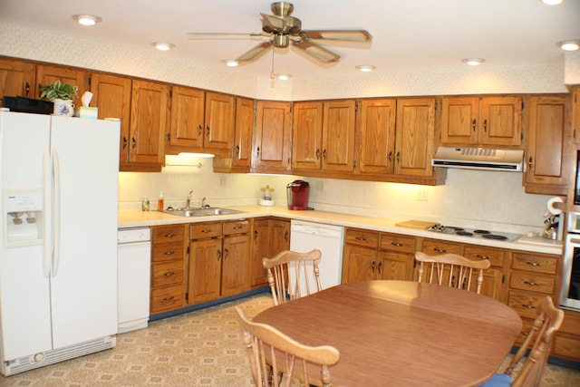 kitchen with white appliances, sink, and ceiling fan