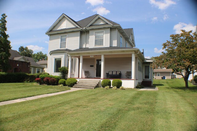 view of front of property with a front lawn and covered porch