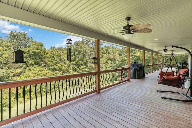 deck featuring a grill and ceiling fan