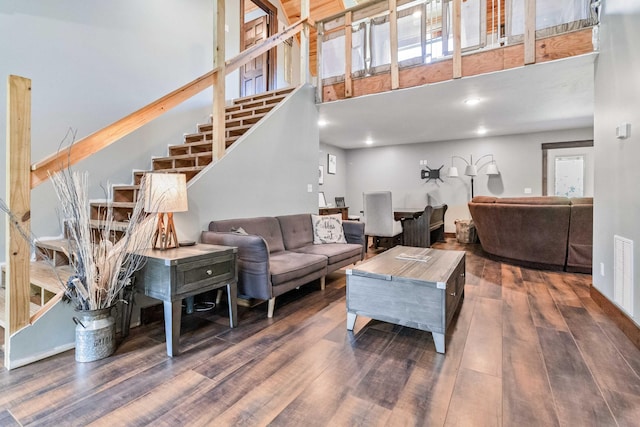 living room with dark hardwood / wood-style flooring