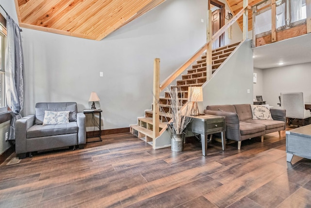 living room featuring dark wood-type flooring, a wealth of natural light, and wooden ceiling