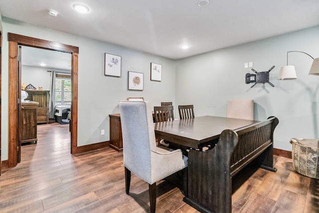 dining area with hardwood / wood-style flooring