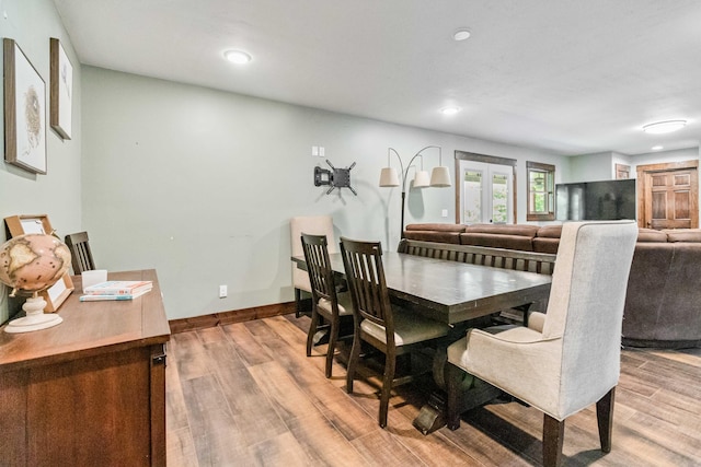 dining area with hardwood / wood-style flooring