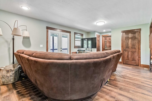 living room with french doors and hardwood / wood-style flooring