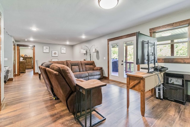 living room with hardwood / wood-style floors and french doors