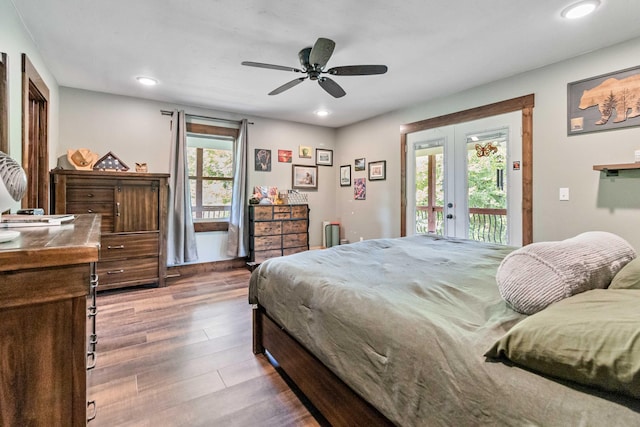 bedroom with french doors, wood-type flooring, access to outside, and ceiling fan