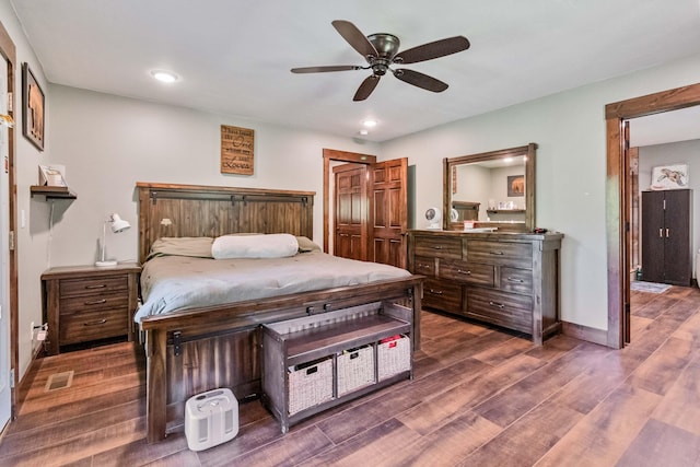 bedroom featuring dark wood-type flooring and ceiling fan