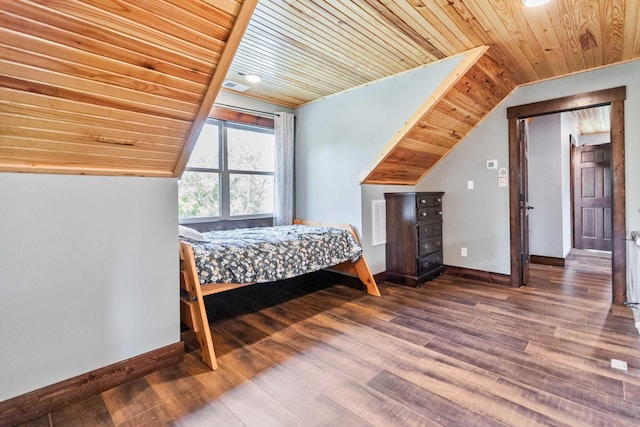 bedroom with wooden ceiling, lofted ceiling, and hardwood / wood-style floors