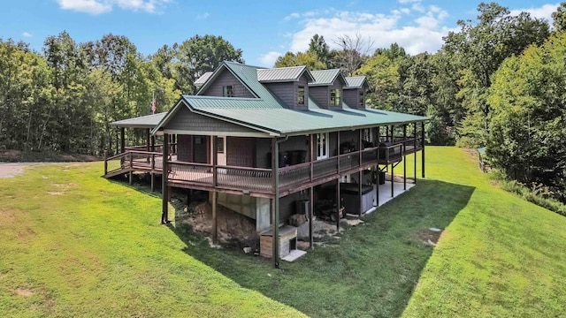 back of property featuring a yard and a wooden deck