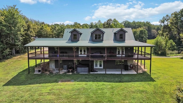 back of property featuring a yard and a patio