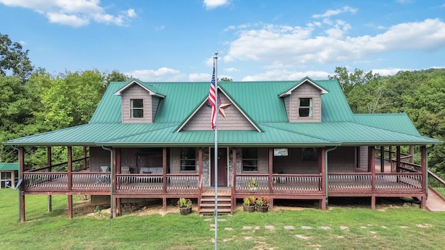 exterior space with a deck and a lawn