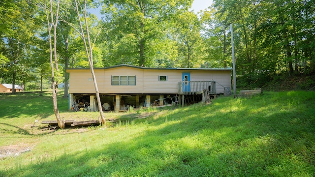 rear view of house with a yard