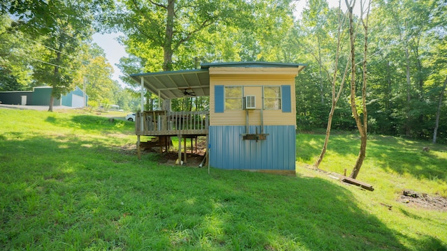 view of outbuilding with a lawn