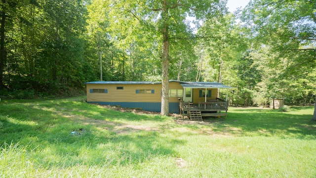 view of yard with a storage shed and a wooden deck