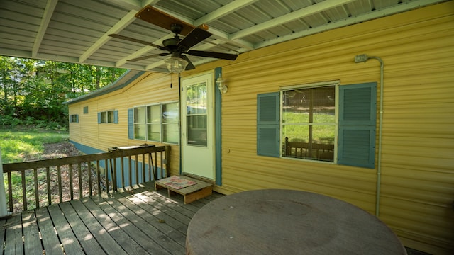 wooden deck featuring ceiling fan