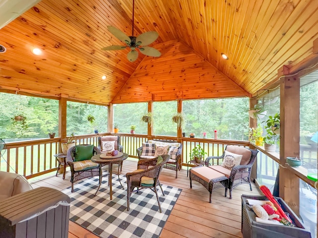 sunroom featuring wood ceiling, lofted ceiling, and ceiling fan