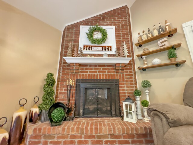 living room with lofted ceiling and a fireplace