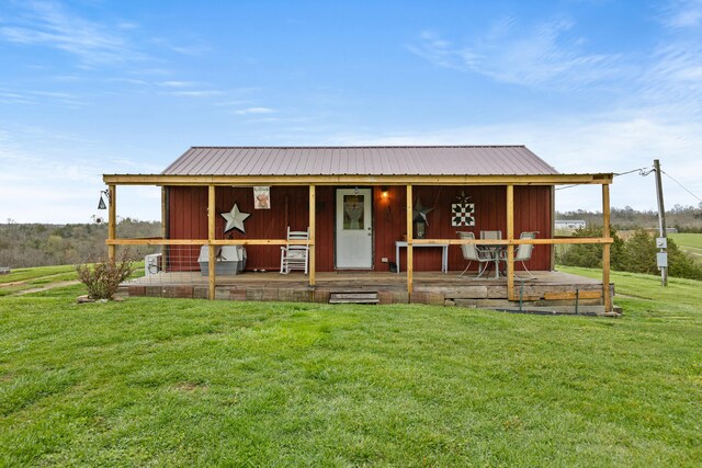 rear view of house with a lawn