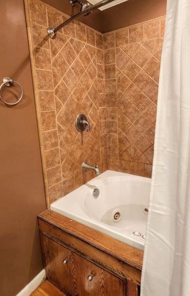 bathroom with shower / tub combo with curtain