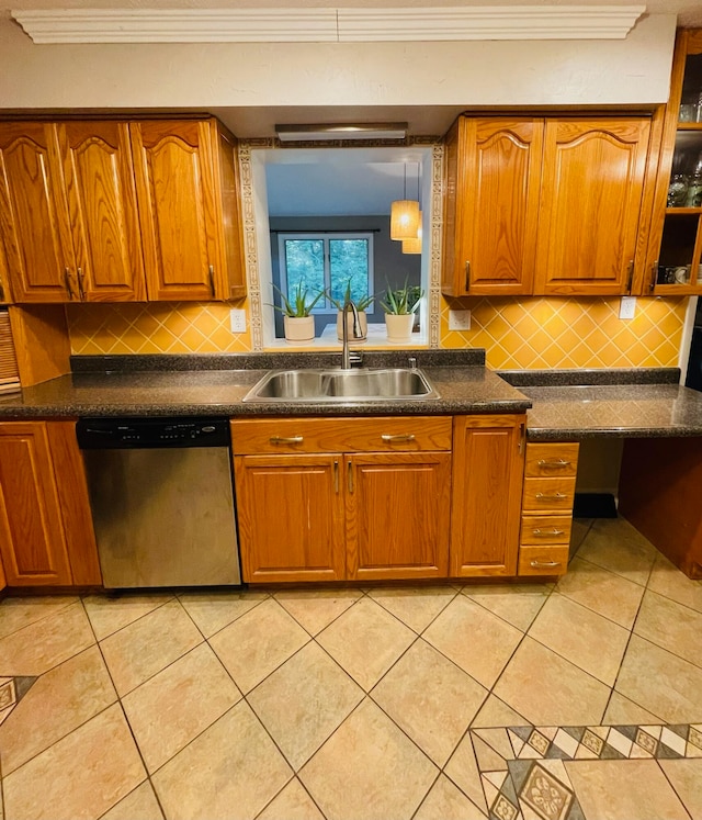 kitchen with decorative light fixtures, light tile patterned floors, stainless steel dishwasher, sink, and decorative backsplash