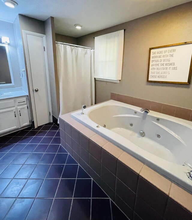 bathroom featuring vanity, tile patterned floors, and plus walk in shower