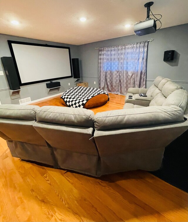 home theater with hardwood / wood-style floors