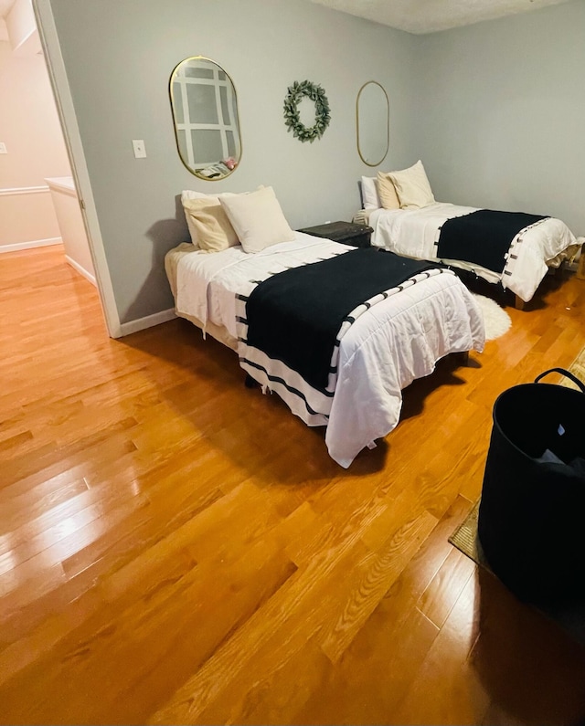 bedroom with hardwood / wood-style floors