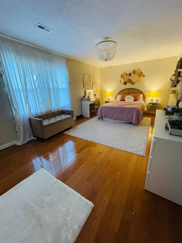 bedroom with hardwood / wood-style flooring