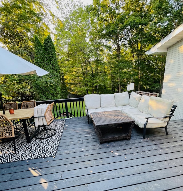 wooden terrace featuring outdoor lounge area