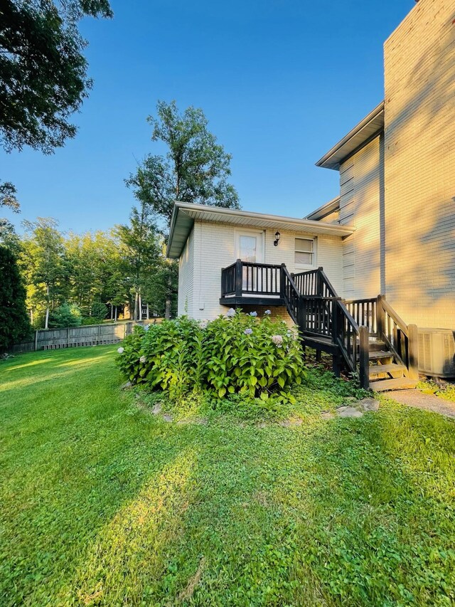 view of yard featuring a wooden deck