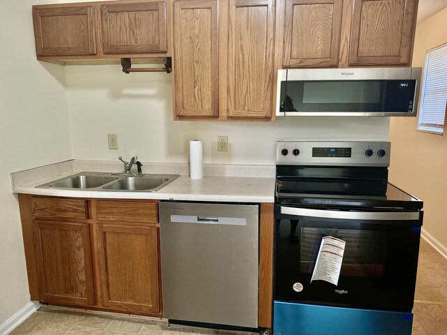 kitchen with appliances with stainless steel finishes and sink