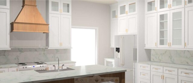 kitchen featuring light stone countertops, white appliances, white cabinetry, and sink