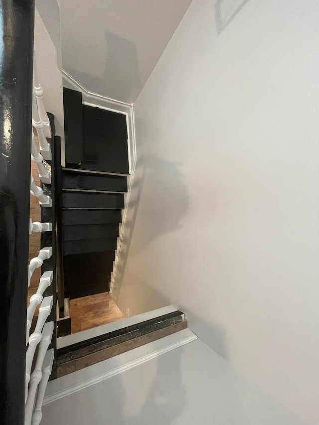 staircase with concrete flooring